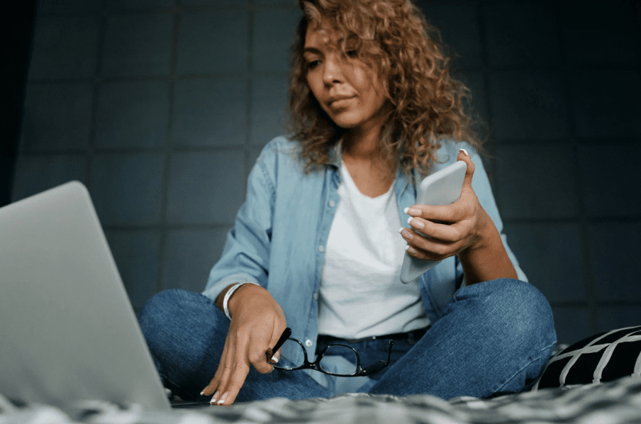 A woman using a laptop.